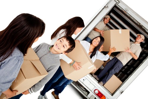 House removal team planning a move in Bermondsey residential street