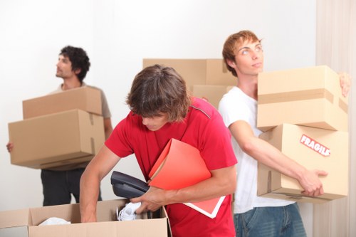 Removal team handling bulky furniture collection in Bermondsey