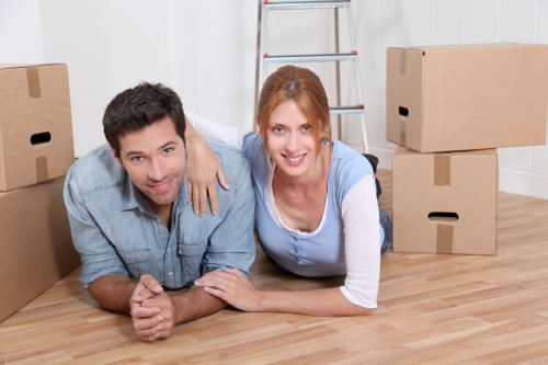 Professional movers transporting furniture through Bermondsey streets