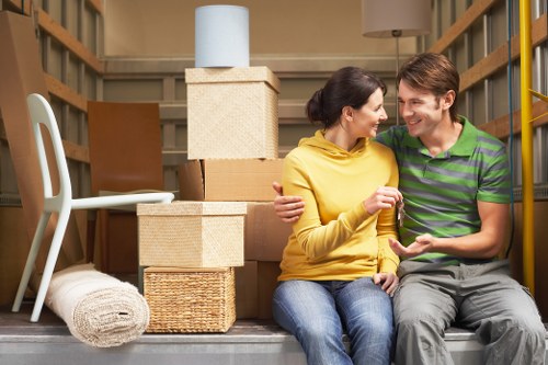 Packed moving boxes and furniture ready for home removals in Bermondsey